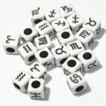 Detailed macro view of 7mm white acrylic square beads with black zodiac sign symbols - 7mm (1950 Pcs/Pack) / White Base Black Font