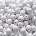 Close-up macro view of white matte soft-touch acrylic beads with straight holes for DIY jewelry - Approx. 1800 Pcs/500g / 8mm / White