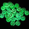 Detailed macro view of luminous green acrylic smiley face beads glowing in the dark. - 4000 Pieces/Pack / Luminous With Colorful Lines