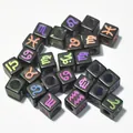 Close-up of 7mm black acrylic cube beads with colorful engraved zodiac symbols - 7mm (1950 Pcs/Pack) / Black with Multicolor Pattern
