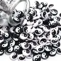 Detailed close-up view of Yin Yang pattern flat beads for DIY bracelet and necklace jewelry making - 7mm*4mm (100 Pieces/Pack) / Black and White Mixed