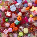 Macro view of vibrant mixed acrylic beads in cartoon shapes for DIY phone charm accessories. - 400-500 Pieces Pack / Random Mixed Colors/Styles