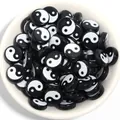 Close-up of black and white Yin Yang Tai Chi flat beads in a white bowl for DIY jewelry. - 7mm*4mm (100 Pieces/Pack) / Black