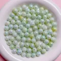 Detail view of 6-10mm AB coated iridescent acrylic round beads for DIY jewelry making - Green