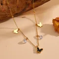 Vue détaillée du collier papillon plaqué or 18 carats avec nacre noire et zircons - Collier Papillon Or Coquillage Noir (C620)