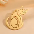 Macro shot of an elegant gold-plated titanium steel abstract cat silhouette brooch - Cat / Gold