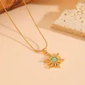 Close-up of golden sunflower pendant necklace featuring a green opal and micro-pave crystals - Necklace / Gold Green Zirconia