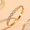 Elegant gold stainless steel bangle featuring a rhinestone-encrusted infinity eye pattern - Infinity Symbol Rhinestone Style (N413) / Gold