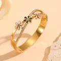 Detail of gold stainless steel bangle featuring enamel flowers and sparkling rhinestones. - Three-Color Flower Style with Diamonds (N412) / Gold