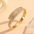 Close-up of elegant gold vacuum plated stainless steel bangle with sparkling crystal inlay - Multi-layer Pave Rhinestone Style (H218) / Gold