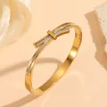 Detailed macro shot of gold titanium steel bangle with sparkling square crystals. - Bowknot Rhinestone Bangle (M713) / Gold
