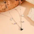 Bracelet papillon argenté en acier inoxydable avec nacre noire et charmes en zircon - Collier Papillon Coquille Noire Couleur Acier (C620)