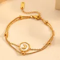 Close-up detail of a double-layered gold anklet featuring a crescent moon charm. - Moon Bracelet (I110) / Gold