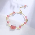 Elegant strawberry quartz bracelet with golden star charms and carved pixiu lucky pendant. - Strawberry Quartz Pixiu Star Bracelet
