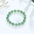 Elegante armband met groene kristallen kralen en goudvergulde tussenstukjes. - Green Strawberry Quartz Style