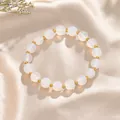 Elegant wit kristallen kralenarmband met goudkleurige tussenkralen voor dames variant - Witte Agaat Gouden Kraal Stijl