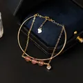 Elegante gouden armband met natuurlijke roze kristalkralen en S925 hartbedeltje - Aardbeienkwarts / Goud