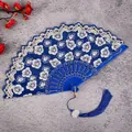 Traditional Chinese blue folding fan with lace floral pattern, elegant tassel for dance. - Royal Blue Cherry Blossom Fans with Large Tassels