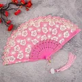 Pink folding fan with white floral lace, hollow handle and tassel for traditional hanfu. - Pink Cherry Blossom Fans with Large Tassels