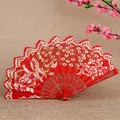 Elegant red Chinese folding fan with peacock pattern and intricate lace-style edges - Red