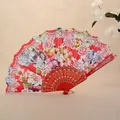 Elegant red Chinese folding fan featuring vibrant rose floral patterns for dance and gifts - Red
