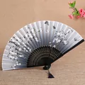 Chinese style folding fan with cherry blossom pattern and black bamboo ribs, elegant design. - Style 1