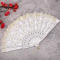 Elegant white lace folding fan with gold floral pattern, perfect for traditional hanfu and dancing. - Sakura White