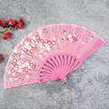Elegant pink folding fan for women featuring a delicate cherry blossom floral print - Pink