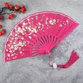 Elegant rose pink folding fan featuring cherry blossom floral pattern and pink silk tassel - Rose Red with Tassel