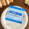 Acrylic road sign refrigerator magnet with Chinese text in lifestyle setting - Ignore the Elders / 70x20mm