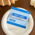 Blue acrylic refrigerator magnet with road sign design and motivational quote, 70x20mm - Happier Today / 70x20mm