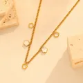 Detailed view of gold stainless steel chain necklace with shell and hollow flower charms - White Shell Flower Necklace (I414)