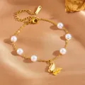 Gold stainless steel butterfly charm bracelet with white pearls for women - Butterfly