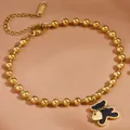 Elegant 18K gold plated titanium steel bead bracelet featuring a cute black bear charm - Black Shell Bear Gold Color Bracelet