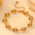 Detailed shot of golden minimalist titanium steel geometric domed round bracelet for women - Round Bracelet H805