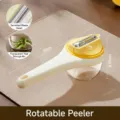 Pelador de verduras giratorio amarillo multifuncional con contenedor y cuchilla de acero - Amarillo