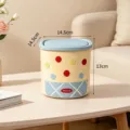 Mini desktop trash bin with pop-up lid in light blue and cream colors, 13cm height - Blue