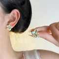 Elegant light blue floral enamel stud earrings featuring shimmering crystal accents - Light Blue Gold Edge Petal Style (EH3416)