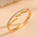 Detailed close-up of 18k gold plated titanium steel bangle with inlaid crystals - Gold Zigzag Bracelet with Rhinestones F721