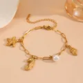 Close-up detail of gold marine charm bracelet featuring starfish, seahorse and pearl. - Seahorse & Starfish Beach Bracelets