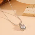 Detailed close-up of a silver-toned hexagonal pendant necklace with sparkling clear stones - Silver Tone White Zircon Necklace