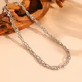 Detailed view of the multi-strand braided stainless steel silver necklace with metal beads. - Necklace / Steel