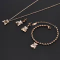 Rose gold stainless steel jewelry set featuring white shell bear pendants and hearts. - White Shell Rose Gold Bear Jewelry Set