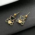 Elegant gold-plated stainless steel black bear stud earrings featuring a delicate heart charm. - Black Shell Bear Gold Color Stud Earrings