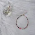 Dainty 2mm rainbow tourmaline beaded bracelet with 14k gold plated adjustable chain. - Single Strawberry Quartz Style