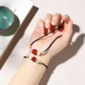 Minimalist black braided jewelry set with red agate and white cat eye beads on wrist - Braided Cord Gold Wrapped (Three Beads) / Bracelet Necklace Set