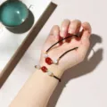 Woven rope jewelry set featuring red agate and white cat eye beads in a black finish - Braided Cord Transfer Bead Gold Thread / Bracelet Necklace Set