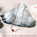Minimalist red agate pendant necklace with black woven cord and gold accents. - Regular Cord Gold Tied (Single Bead) Necklace / Single Necklace