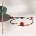 Hand-woven black cord bracelet with red agate and white cat eye beads and gold thread - Regular Cord Gold Wrapped (Three Beads) Bracelet / Single Bracelet