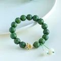 Handcrafted green Bodhi seed mantra bracelet featuring a cute cream cat paw charm accessory. - Imperial Green Cat Paw Style